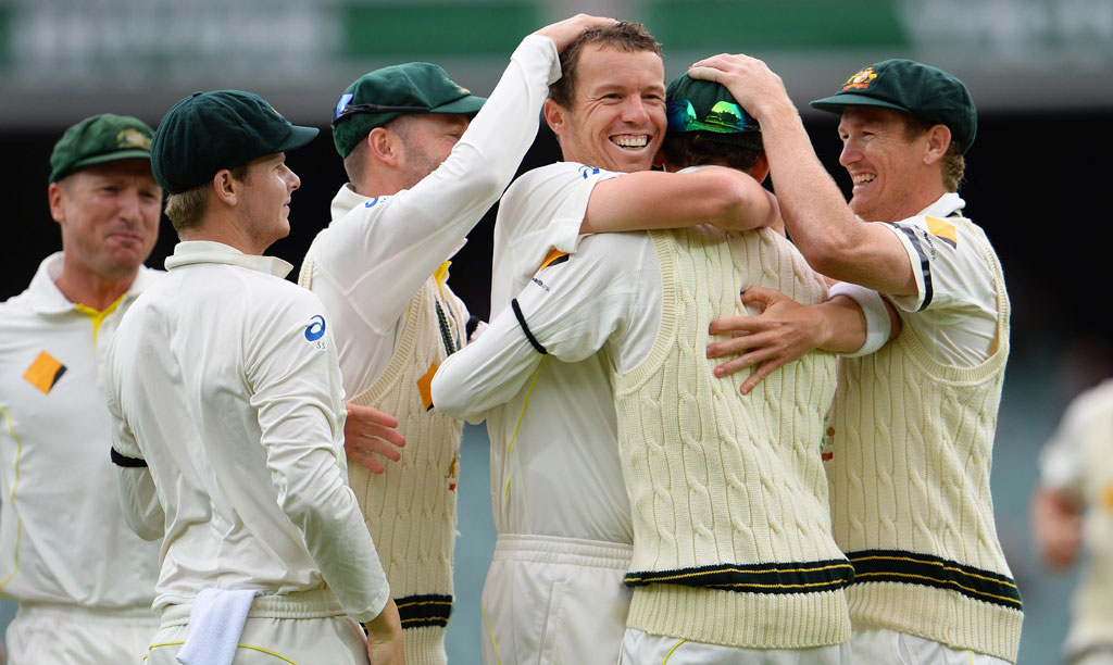 Australian fast bowler Peter Siddle (3/R) is congratulated by teammates after dismissing England batsman Stuart Broad on the final day of the second Ashes cricket Test match in Adelaide, on December 9, 2013. Australian fast bowler Peter Siddle (3/R) is congratulated by teammates after dismissing England batsman Stuart Broad on the final day of the second Ashes cricket Test match in Adelaide, on December 9, 2013.