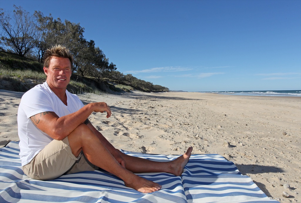 Chris Reynolds with his CGear Multimat for beachgoers. Another version of the mat has found a solid market in the camping and military sectors. Chris Reynolds with his CGear Multimat for beachgoers. Another version of the mat has found a solid market in the camping and military sectors.