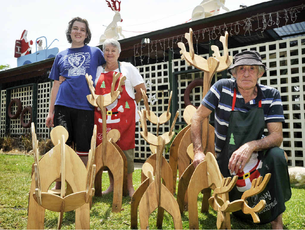 CRAFTY LOT: Brayden Peck, Marie Dudgeon and Trevor Dudgeon, who make and sell wooden Christmas decorations in Bangalow. CRAFTY LOT: Brayden Peck, Marie Dudgeon and Trevor Dudgeon, who make and sell wooden Christmas decorations in Bangalow.