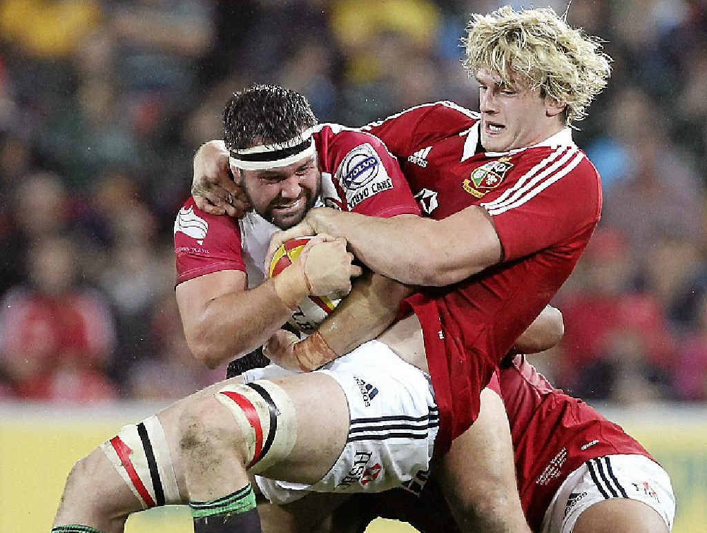 STILL OUT: James Hanson of the Reds (left) is tackled by British and Irish Lions forward Richie Gray in Hanson’s last game before picking up a neck injury. STILL OUT: James Hanson of the Reds (left) is tackled by British and Irish Lions forward Richie Gray in Hanson’s last game before picking up a neck injury.