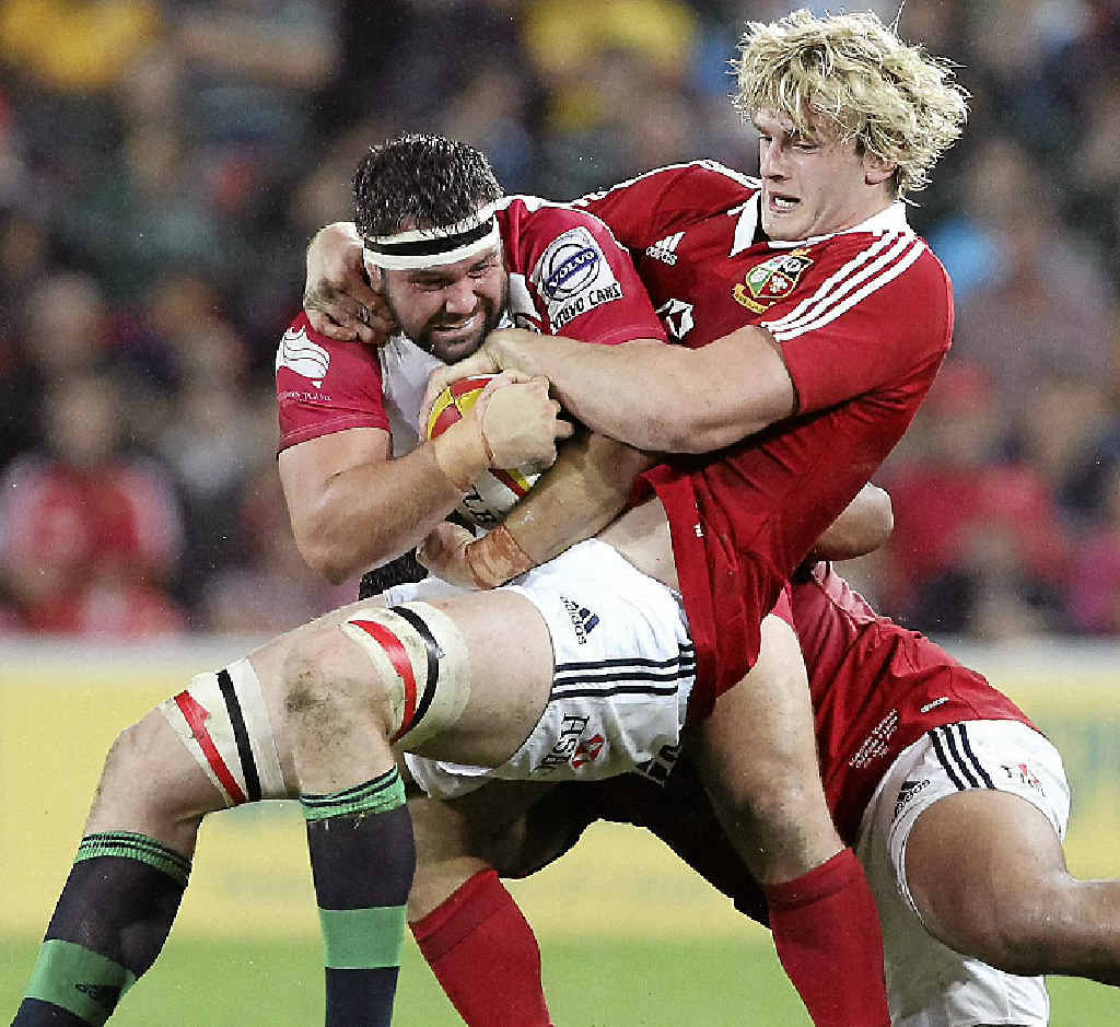 STILL OUT: James Hanson of the Reds (left) is tackled by British and Irish Lions forward Richie Gray in Hanson’s last game before picking up a neck injury. STILL OUT: James Hanson of the Reds (left) is tackled by British and Irish Lions forward Richie Gray in Hanson’s last game before picking up a neck injury.