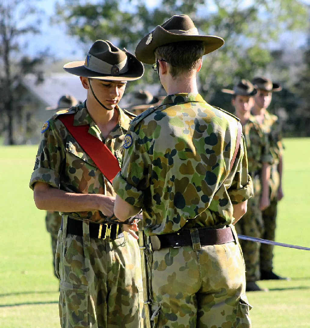 PASSED ON: Sgt Michael Jones receives the First World War light horseman sabre from CUO Matthew Bailey in a handover of control of the cadet unit. PASSED ON: Sgt Michael Jones receives the First World War light horseman sabre from CUO Matthew Bailey in a handover of control of the cadet unit.