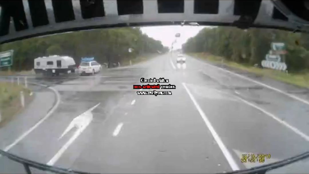 A still from a video posted to LiveLeak showing a crash between a truck and a 4WD towing a caravan on the Pacific Highway at the Iluka turn-off in October. A still from a video posted to LiveLeak showing a crash between a truck and a 4WD towing a caravan on the Pacific Highway at the Iluka turn-off in October.
