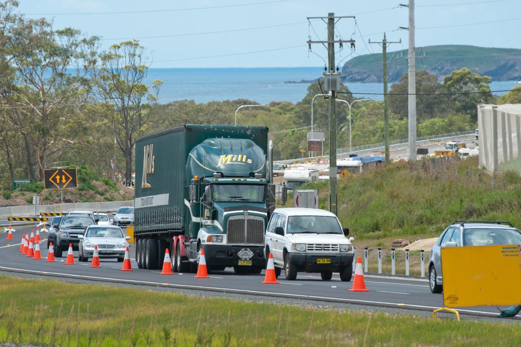 The first vehicles to use the newly opened Woolgoolga bypass section of the Pacific Hwy head north. Photo: Rob Wright / Coffs Coast Advocate The first vehicles to use the newly opened Woolgoolga bypass section of the Pacific Hwy head north. Photo: Rob Wright / Coffs Coast Advocate