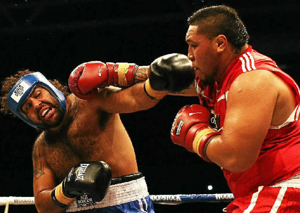 SLAMMIN’ SAM: Sam Thaiday (left) takes on rugby union player Ben Tameifuna. SLAMMIN’ SAM: Sam Thaiday (left) takes on rugby union player Ben Tameifuna.
