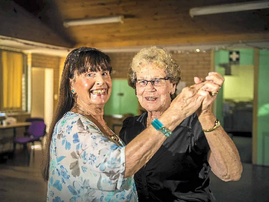 Elaine Cox and Valda Garson practice for the Benaraby Progress Association's benefit dance on Saturday.