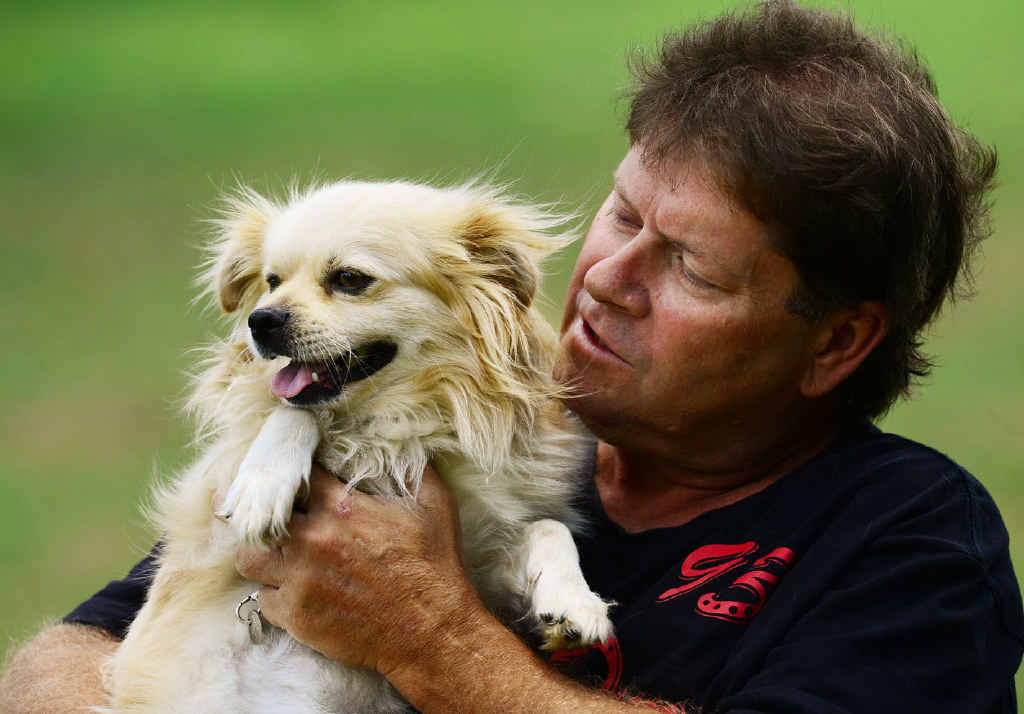 REUNION RELIEF: Calvin Brewster, of Brassall, hugs his dog Bo who was found after 18 months. REUNION RELIEF: Calvin Brewster, of Brassall, hugs his dog Bo who was found after 18 months.