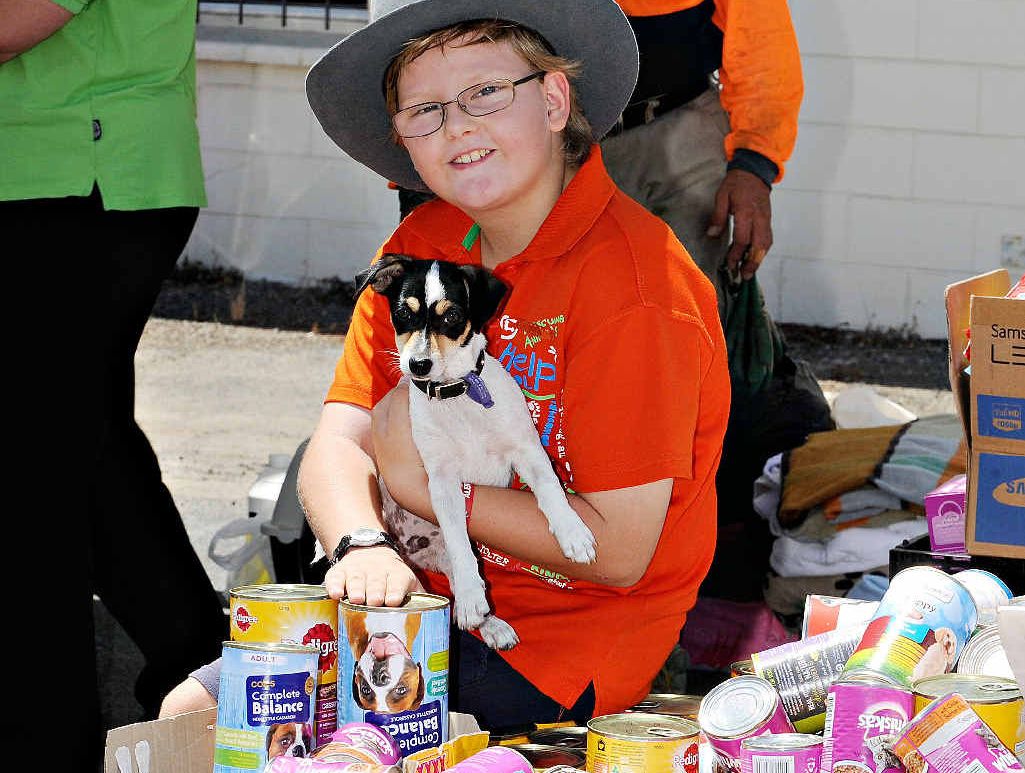 Emmett Withers with his donation of animal food. Emmett Withers with his donation of animal food.