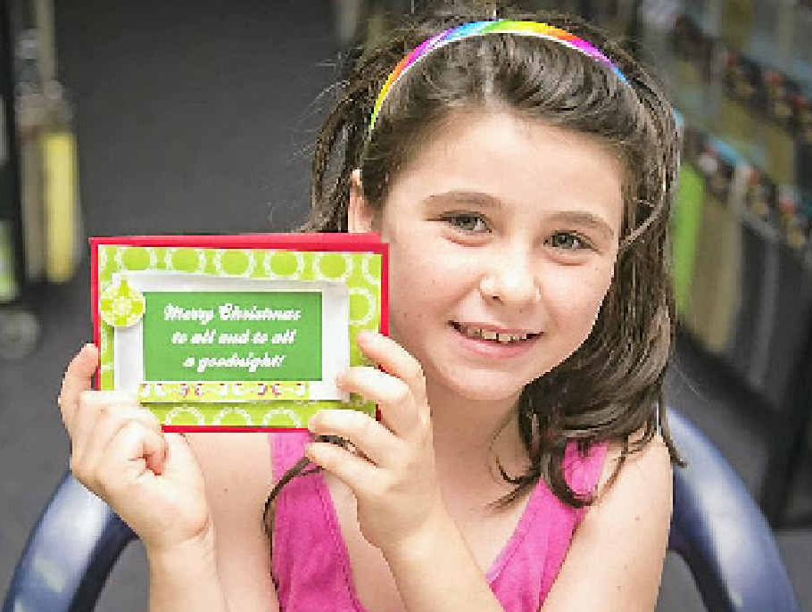 Sadsh Quinn, 7, at the card-making activities at Scrapbook Fantasies.