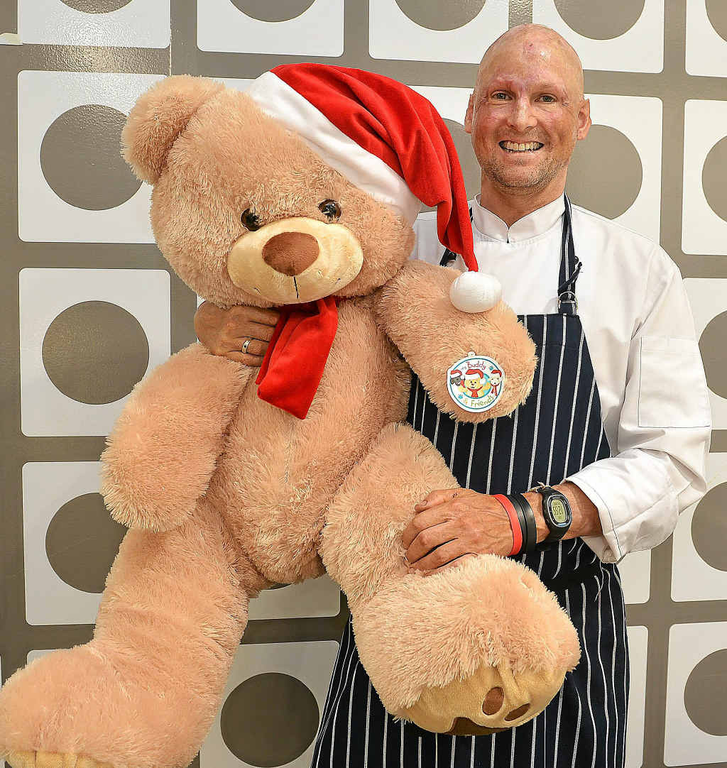 CHEERING UP FINN: Celebrity chef Matt Golinski appeared at Maroochydore’s Harvey Norman for a cooking demonstration. He organised this giant teddy bear for Finn Smith. CHEERING UP FINN: Celebrity chef Matt Golinski appeared at Maroochydore’s Harvey Norman for a cooking demonstration. He organised this giant teddy bear for Finn Smith.
