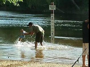 A Facebook photo showing a nine-month-old splashing at Cahills Crossing on the croc-infested East Alligator River. A Facebook photo showing a nine-month-old splashing at Cahills Crossing on the croc-infested East Alligator River.