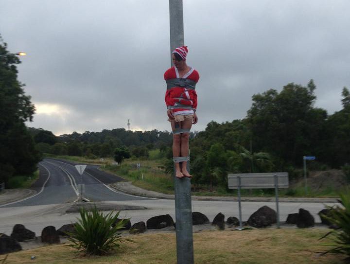 Timothy Hend celebrates Christmas at Ocean Shores by having himself taped part-way up a light pole. Timothy Hend celebrates Christmas at Ocean Shores by having himself taped part-way up a light pole.