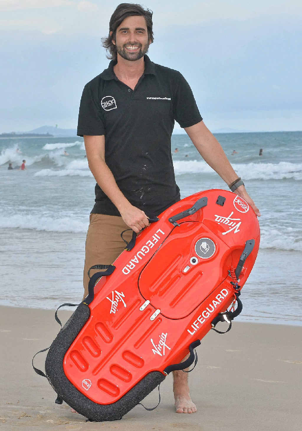LIFE SAVER: Ross Kemp with his one-person rescue surfcraft, Asap. LIFE SAVER: Ross Kemp with his one-person rescue surfcraft, Asap.
