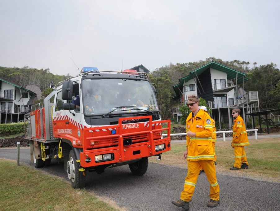 RFS protect the Linneaus Esate, at the Fires at Lennox Head on Monday. Photo Doug Eaton / The Northern Star RFS protect the Linneaus Esate, at the Fires at Lennox Head on Monday. Photo Doug Eaton / The Northern Star