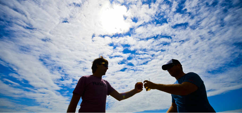 HERE’S CHEERS: Tom Spencer and Dave Caskey get ready to salute the New Year on the balcony of the Pacific Hotel in Yamba. Photo: Adam Hourigan HERE’S CHEERS: Tom Spencer and Dave Caskey get ready to salute the New Year on the balcony of the Pacific Hotel in Yamba. Photo: Adam Hourigan