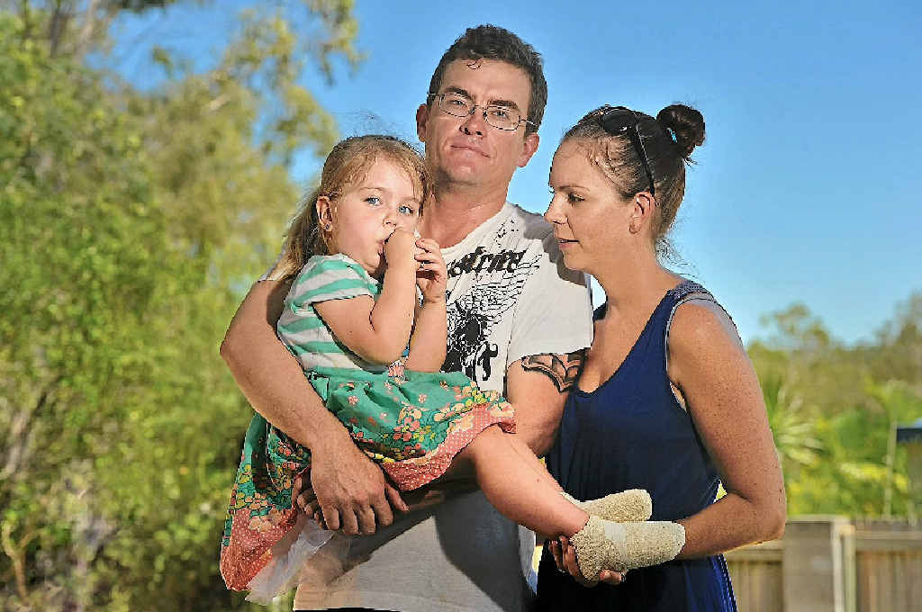 Sienna Maunders, 3, with parents Tony and Cindy. Sienna received second-degree burns from playground equipment at Tannum Sands. Sienna Maunders, 3, with parents Tony and Cindy. Sienna received second-degree burns from playground equipment at Tannum Sands.