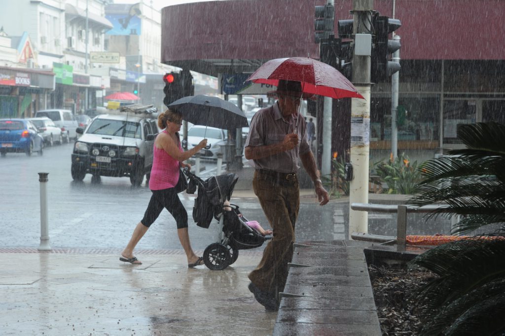 Image for sale: Rainfall predications appear to have forewarned shoppers in downtown Maryborough who were armed with umbrellas in readiness for sporadic downpours. Photo: Robyne Cuerel / Fraser Coast Chronicle