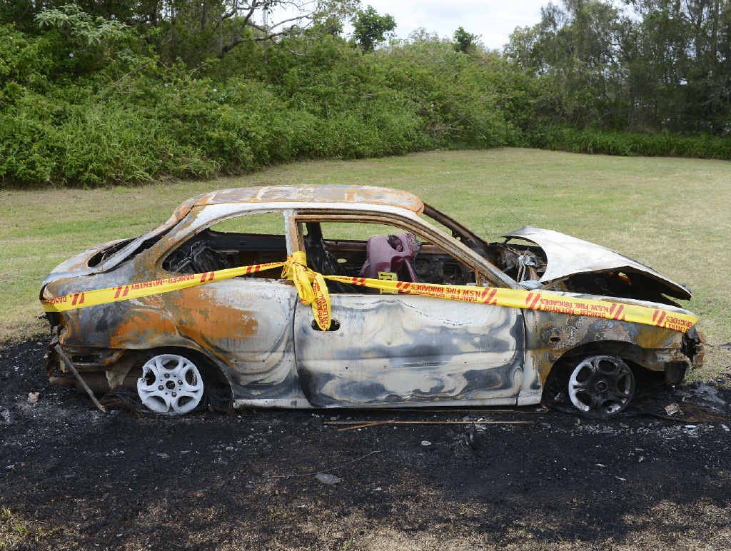 PHILOSOPHICAL: The Moerman’s burnt out car near Oyster Channel in Yamba contained Christmas gifts including a bike for son Zac. Photo Adam Hourigan PHILOSOPHICAL: The Moerman’s burnt out car near Oyster Channel in Yamba contained Christmas gifts including a bike for son Zac. Photo Adam Hourigan