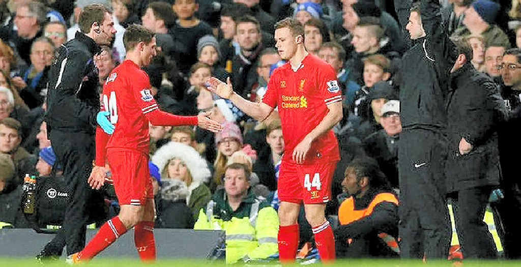 IN THE SPOTLIGHT: A proud moment for former Lennox Head Sharks junior Brad Smith (right), as he comes off the bench to make his debut for Liverpool. IN THE SPOTLIGHT: A proud moment for former Lennox Head Sharks junior Brad Smith (right), as he comes off the bench to make his debut for Liverpool.