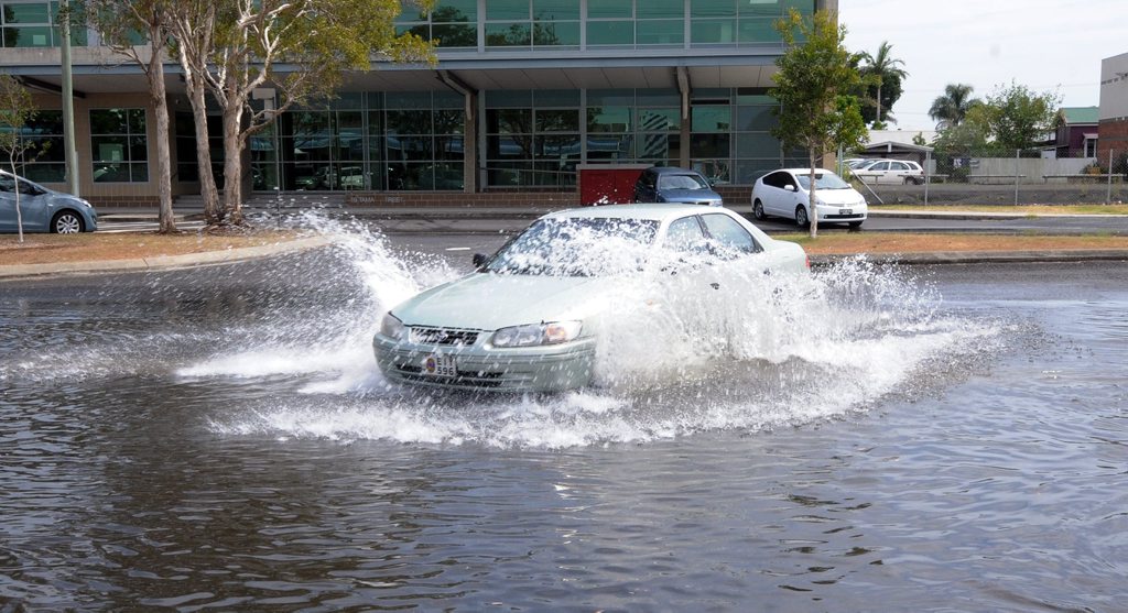 A car hits the King tide in Ballina on Thursday in Tamar street, Ballina. A car hits the King tide in Ballina on Thursday in Tamar street, Ballina.