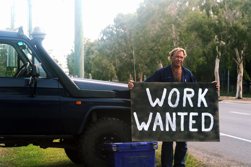 Guy Clark, 49, is so eager to find employment that he is advertising on the side of the road. Guy Clark, 49, is so eager to find employment that he is advertising on the side of the road.