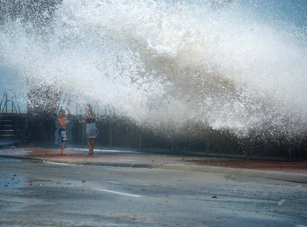 Foam and spray shoot metres over the Urangan seawall on Saturday. Foam and spray shoot metres over the Urangan seawall on Saturday.