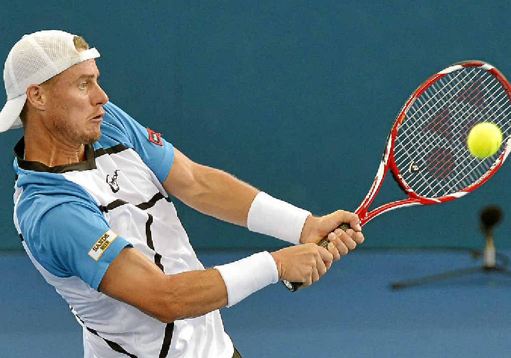 BRISBANE SUCCESS: Lleyton Hewitt plays a backhand in the Brisbane International final against Roger Federer yesterday. BRISBANE SUCCESS: Lleyton Hewitt plays a backhand in the Brisbane International final against Roger Federer yesterday.