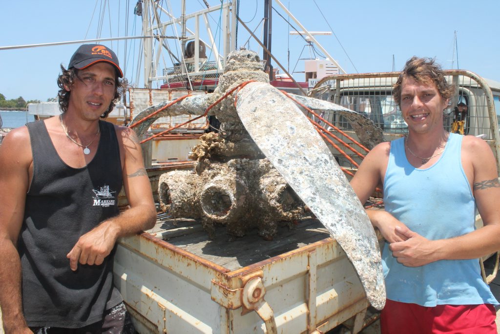 UNUSUAL CATCH: Ballina trawlermen Brendan Puglisi (left) and Shaun Cameron with what is believed to be a WWII vintage aircraft engine they pulled up from the ocean floor last Thursday night. Photo Graham Broadhead / Ballina Shire Advocate UNUSUAL CATCH: Ballina trawlermen Brendan Puglisi (left) and Shaun Cameron with what is believed to be a WWII vintage aircraft engine they pulled up from the ocean floor last Thursday night. Photo Graham Broadhead / Ballina Shire Advocate