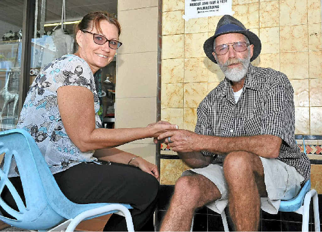 WELL READ: Shari Weston has her palm read by Peter the Reader in Byron Bay. WELL READ: Shari Weston has her palm read by Peter the Reader in Byron Bay.