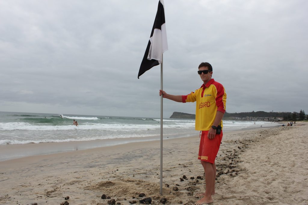 Another day at the office; Lennox Head lifeguard Matt Laverty. Photo Andy Parks / The Northern Star Another day at the office; Lennox Head lifeguard Matt Laverty. Photo Andy Parks / The Northern Star
