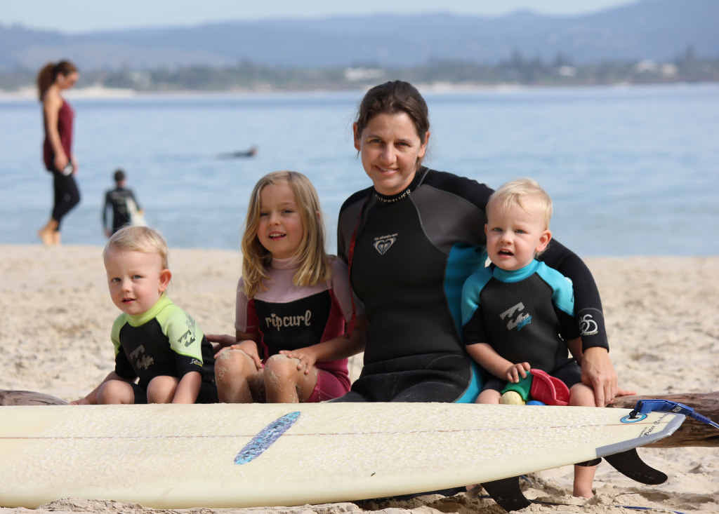 OCEAN BECKONS: Surfing mum Danya Hodgetts with her children Jake, Layne and Jordan. OCEAN BECKONS: Surfing mum Danya Hodgetts with her children Jake, Layne and Jordan.
