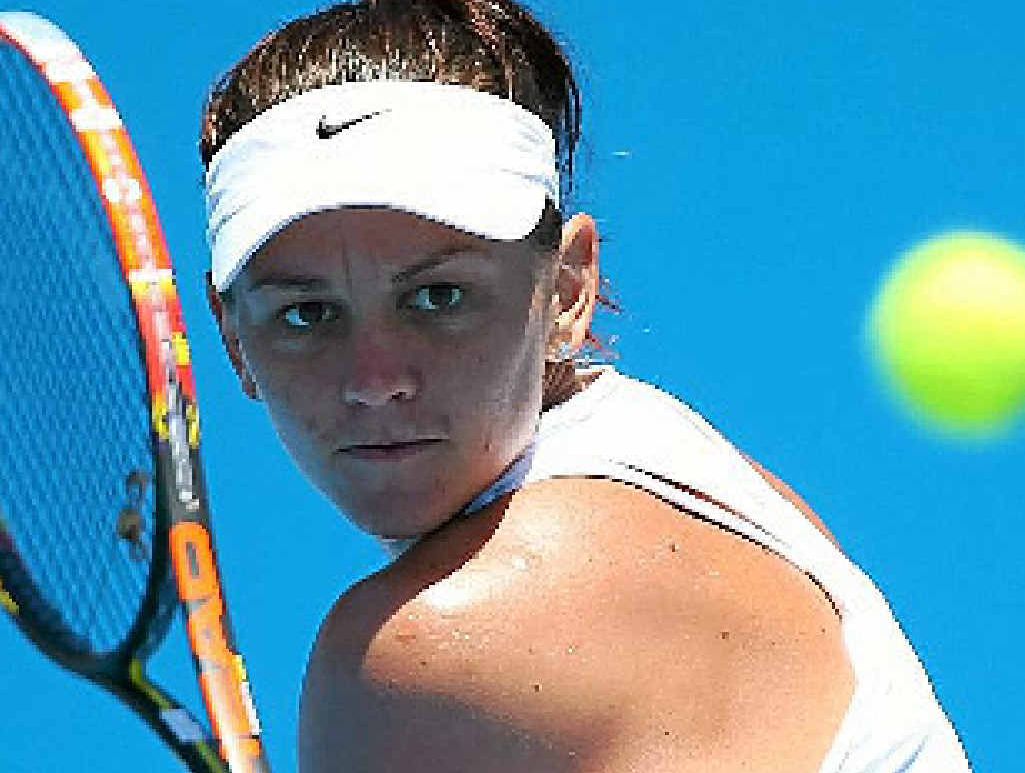 ON COURT: Australia’s Casey Dellacqua of Australia plays a backhand in her first round match against Vera Zvonareva of Russia. ON COURT: Australia’s Casey Dellacqua of Australia plays a backhand in her first round match against Vera Zvonareva of Russia.