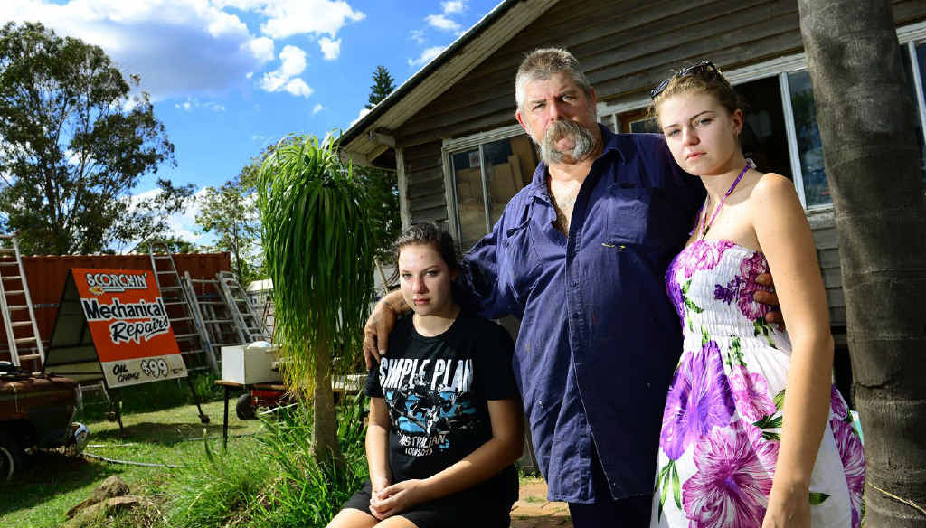 DESPERATE: Kevin Dawber of Coolana with his daughters Gypsy (left), 15, and Holly,18, are still waiting for insurance payouts following the 2011 floods. DESPERATE: Kevin Dawber of Coolana with his daughters Gypsy (left), 15, and Holly,18, are still waiting for insurance payouts following the 2011 floods.