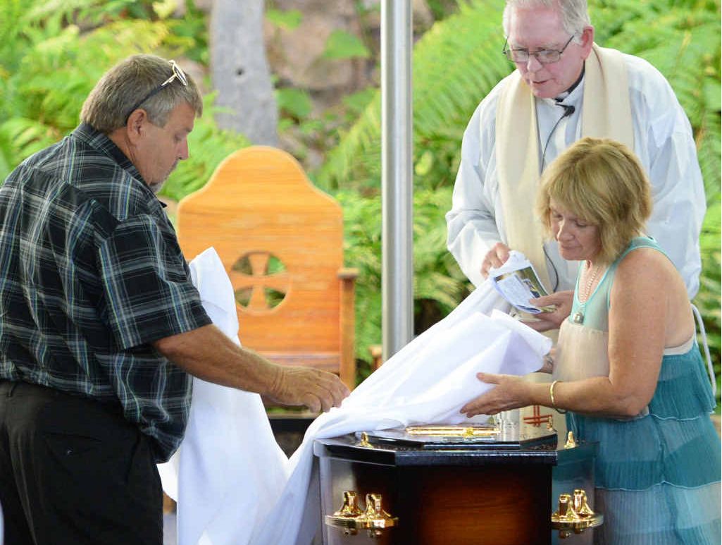 Kelvin and Roxanne West place the pall on the casket at the funeral of Kurtis West held at the Holy Family Catholic Church. Photo: Chris Ison / The Morning Bulletin Kelvin and Roxanne West place the pall on the casket at the funeral of Kurtis West held at the Holy Family Catholic Church. Photo: Chris Ison / The Morning Bulletin