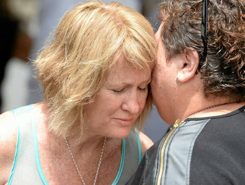 TRAGEDY: Kurtis West’s mother Roxanne West (left) is comforted by a friend at his funeral at the Holy Family Catholic Church on Friday. TRAGEDY: Kurtis West’s mother Roxanne West (left) is comforted by a friend at his funeral at the Holy Family Catholic Church on Friday.