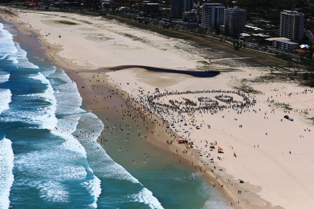 Aerial view of the 2500 people mapping out WSR - World Surfing Reserve - as part of Sunday January 19, North Kirra rally.