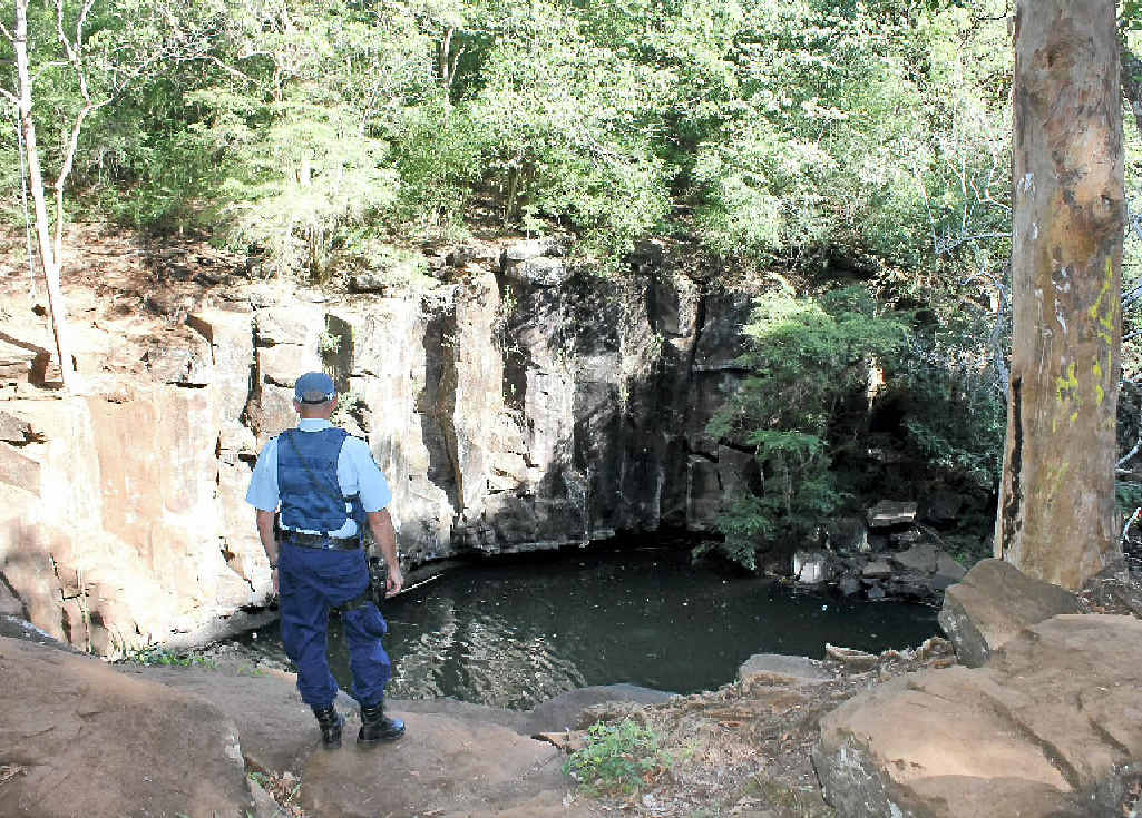 TRAGEDY: Police inspect the scene near Ballina. TRAGEDY: Police inspect the scene near Ballina.