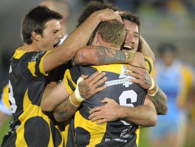 Local rugby league grand final between Caboolture and Gympie at Stockland Park: Caboolture's Mitch Morrison, facing camera, is hugged by team mates after scoring a try. Photo: Brett Wortman / Sunshine Coast Daily