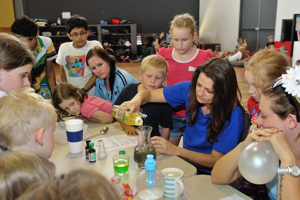 Science day at the PCYC - Renar Brunning conducts an experiment while Zephryn Hines and the other kids watch. Science day at the PCYC - Renar Brunning conducts an experiment while Zephryn Hines and the other kids watch.