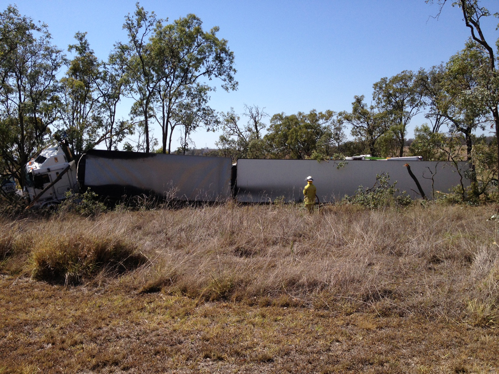 A crane has been called in to right the overturned trailer of a B-double that rolled on the Gore Highway south of Toowoomba. A crane has been called in to right the overturned trailer of a B-double that rolled on the Gore Highway south of Toowoomba.