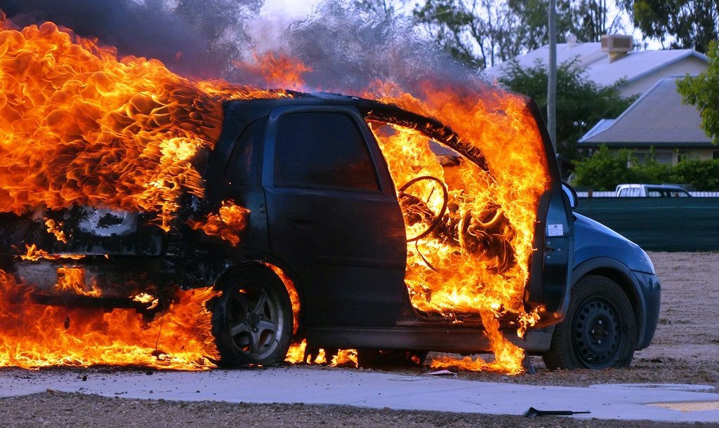 A Holden Barina goes up in flames in Currey St at Roma. A Holden Barina goes up in flames in Currey St at Roma.