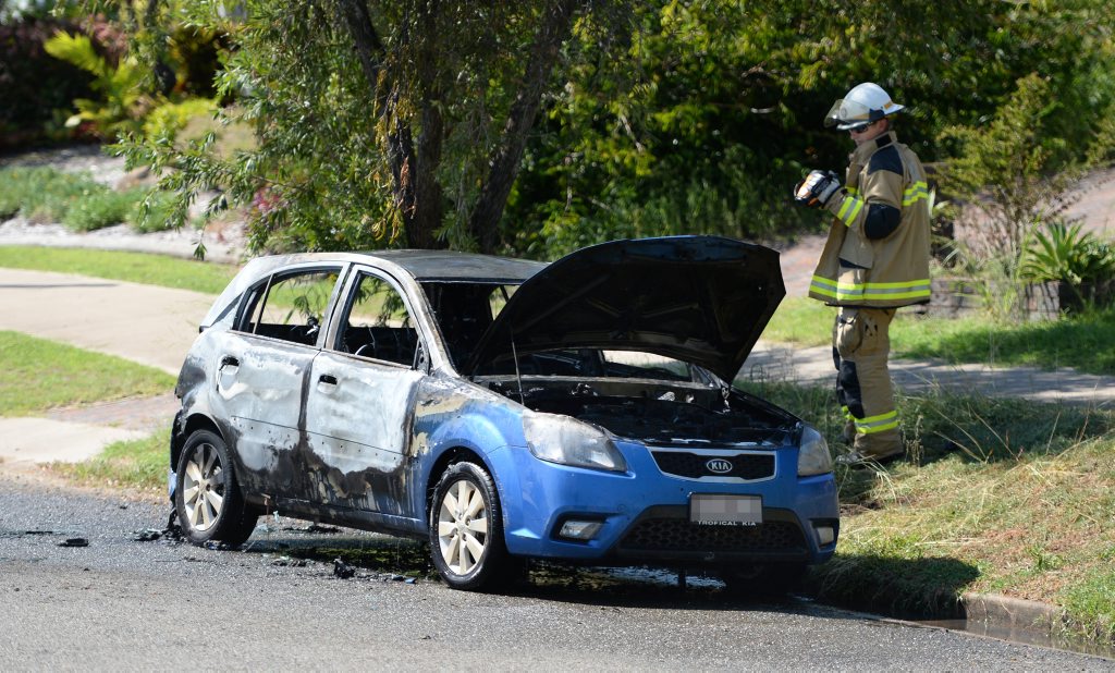 A fire officer checks for hot spots after a car fire was extinguished outside a Wiggington St home in Frenchville. Photo: Chris Ison / The Morning Bulletin A fire officer checks for hot spots after a car fire was extinguished outside a Wiggington St home in Frenchville. Photo: Chris Ison / The Morning Bulletin