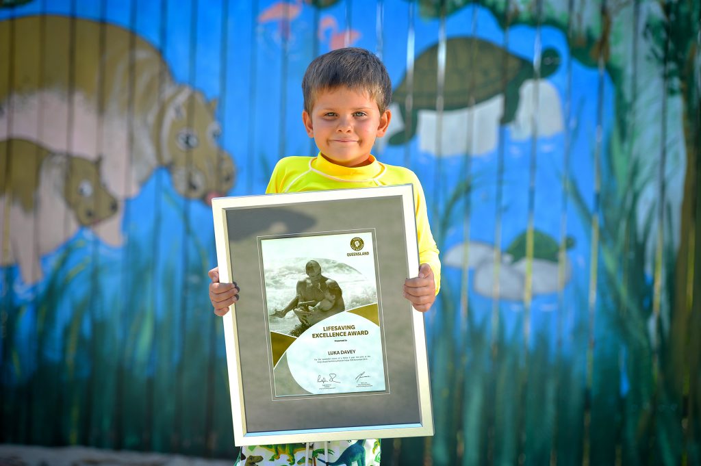 4 year old Luka Davey is given an Lifesaving Excellence Award for his assistance in a rescue at Kings Beach. The award was presented by SLSQ's regional manager Aaron Purchase at the Goodstart Early Learning centre in Caloundra. Photo: Warren Lynam / Sunshine Coast Daily 4 year old Luka Davey is given an Lifesaving Excellence Award for his assistance in a rescue at Kings Beach. The award was presented by SLSQ's regional manager Aaron Purchase at the Goodstart Early Learning centre in Caloundra. Photo: Warren Lynam / Sunshine Coast Daily