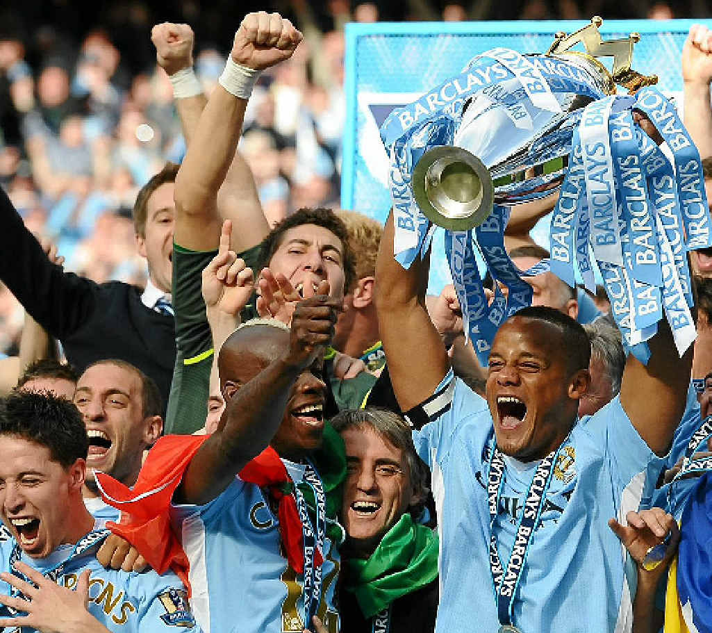 BIG TIME: Manchester City captain Vincent Kompany celebrates his team’s EPL premiership win. The owners of the EPL giants recently acquired an 80% stake of A-League club Melbourne Heart (players pictured inset). BIG TIME: Manchester City captain Vincent Kompany celebrates his team’s EPL premiership win. The owners of the EPL giants recently acquired an 80% stake of A-League club Melbourne Heart (players pictured inset).