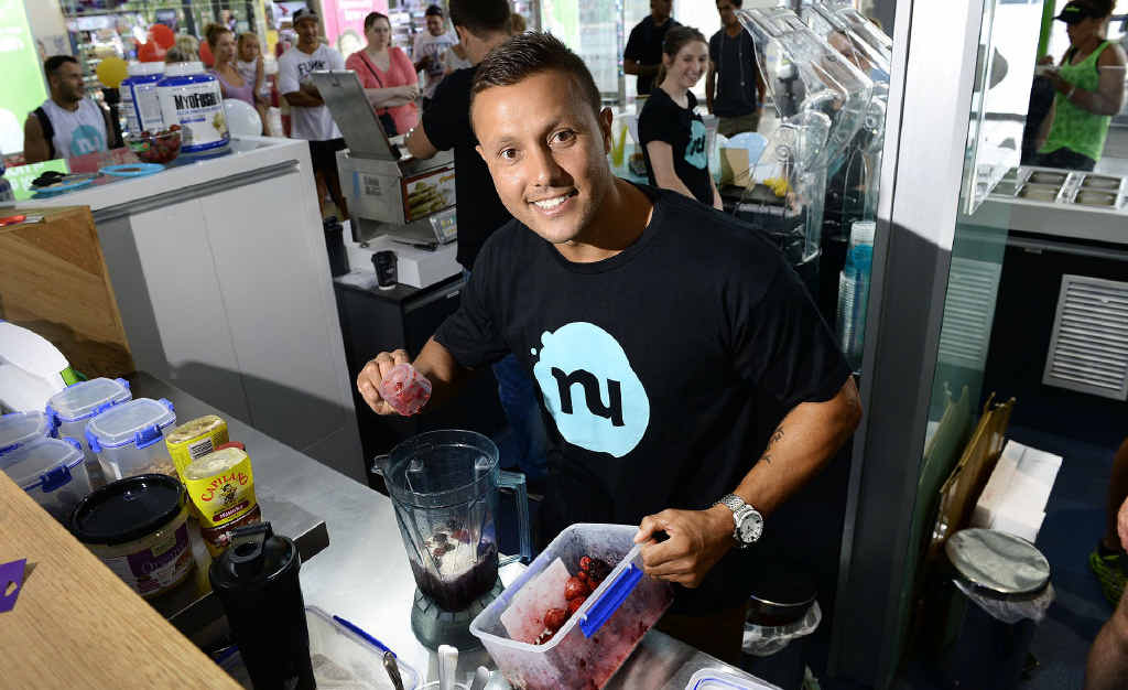 HEALTHY MIX: Former Queensland origin player Scott Prince prepares a smoothie at Nutrition Station, a new Riverlink store. HEALTHY MIX: Former Queensland origin player Scott Prince prepares a smoothie at Nutrition Station, a new Riverlink store.