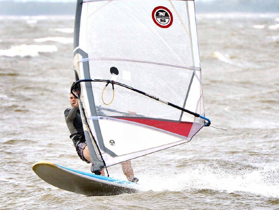 Windsurfer Tom Williams makes the most of the windy weather and the public holiday at Town Beach. Windsurfer Tom Williams makes the most of the windy weather and the public holiday at Town Beach.