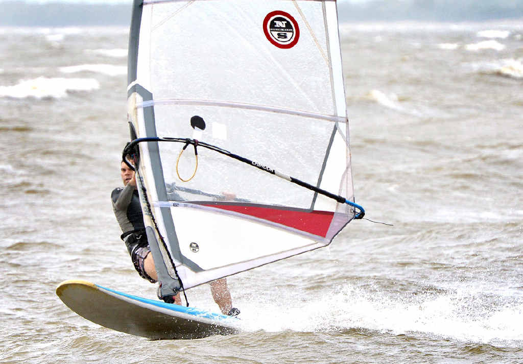 Windsurfer Tom Williams makes the most of the windy weather and the public holiday at Town Beach. Windsurfer Tom Williams makes the most of the windy weather and the public holiday at Town Beach.