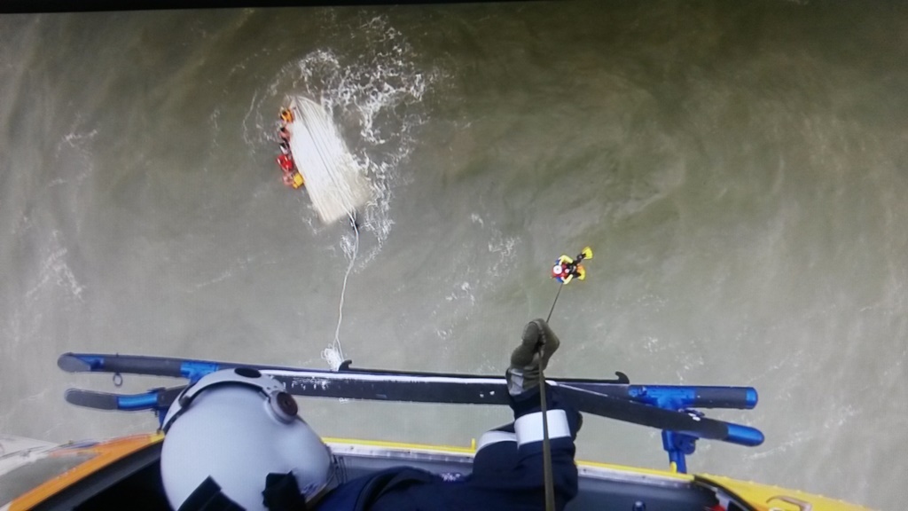 One of the family members being winched by the RACQ Capricorn Rescue Helicopter. One of the family members being winched by the RACQ Capricorn Rescue Helicopter.