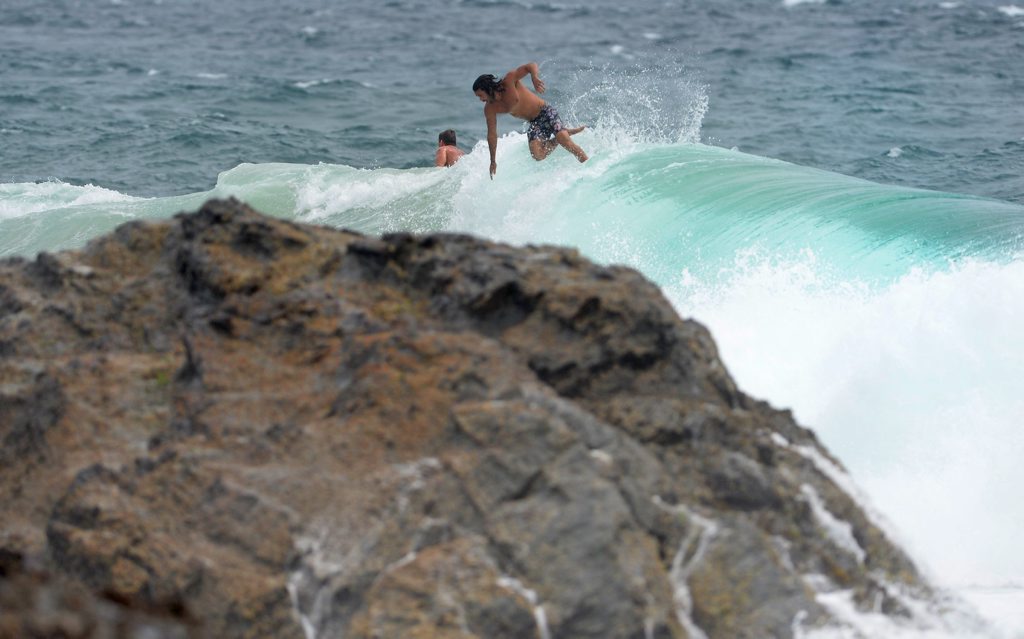 A surfer at Snapper Rocks in a dangerous free fall in the large swell. A surfer at Snapper Rocks in a dangerous free fall in the large swell.