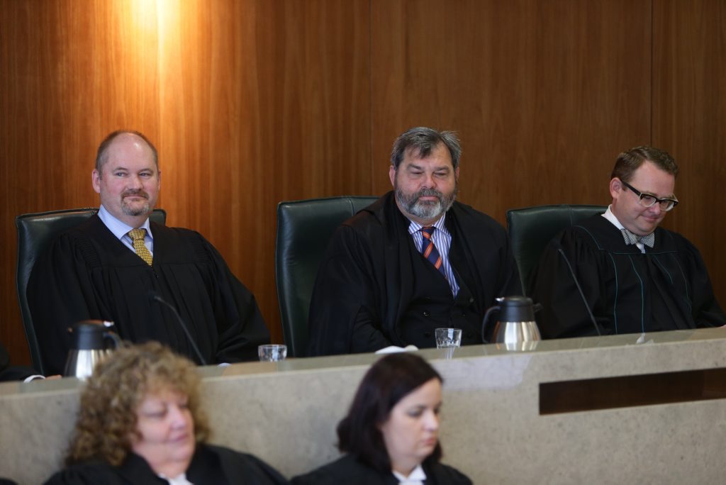 The swearing in of new magistrates Simon Young (left) and Aaron Simpson (right) by Chief Magistrate Tim Carmody at Brisbane Magistrates court. Pic Annette Dew/Pool The swearing in of new magistrates Simon Young (left) and Aaron Simpson (right) by Chief Magistrate Tim Carmody at Brisbane Magistrates court. Pic Annette Dew/Pool